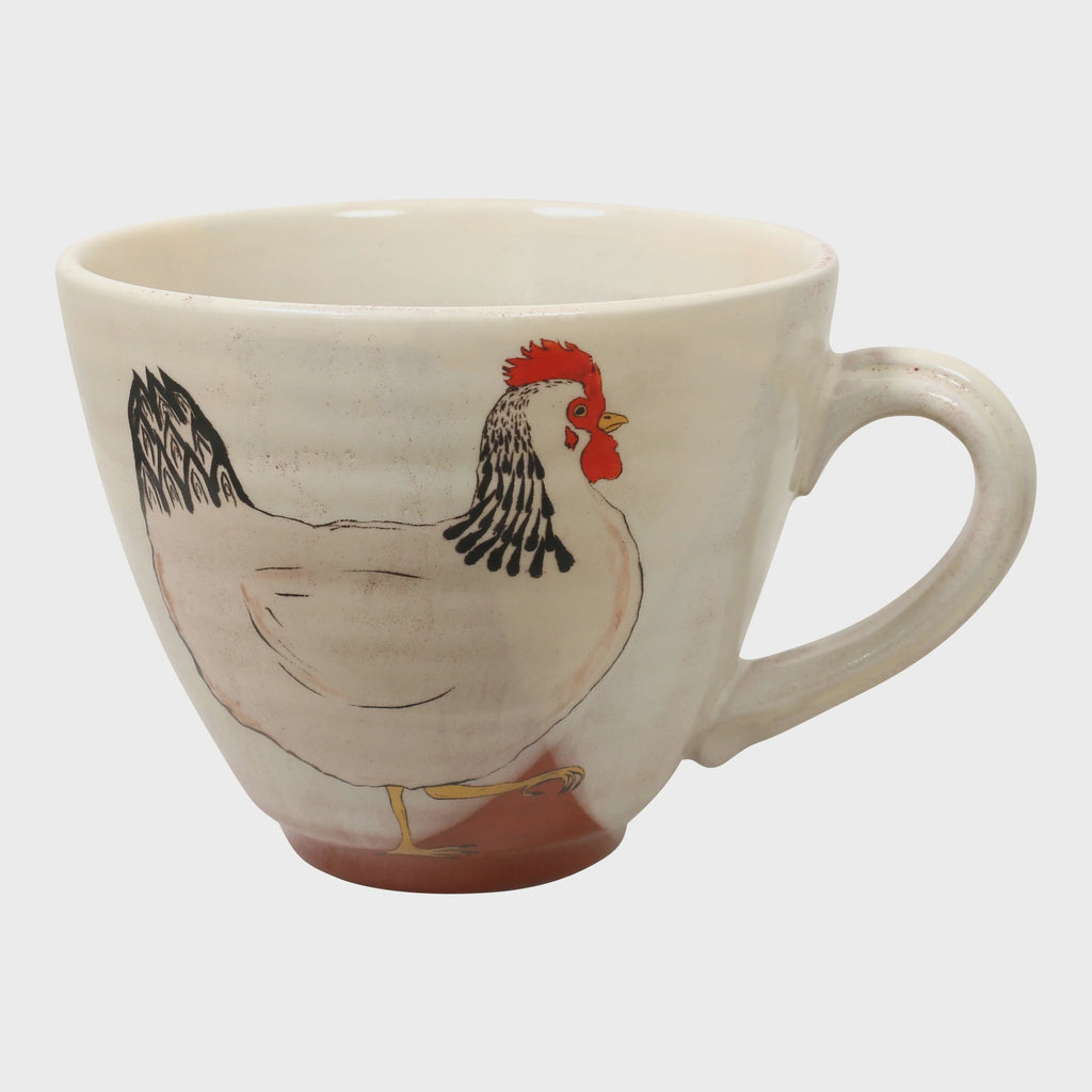 A white white mug with a chicken print