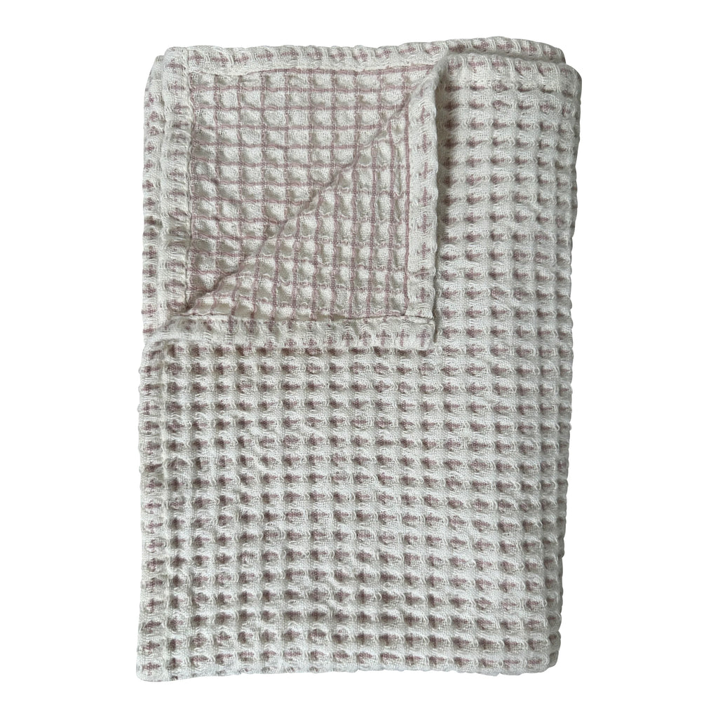 White and light pink waffle tea towel