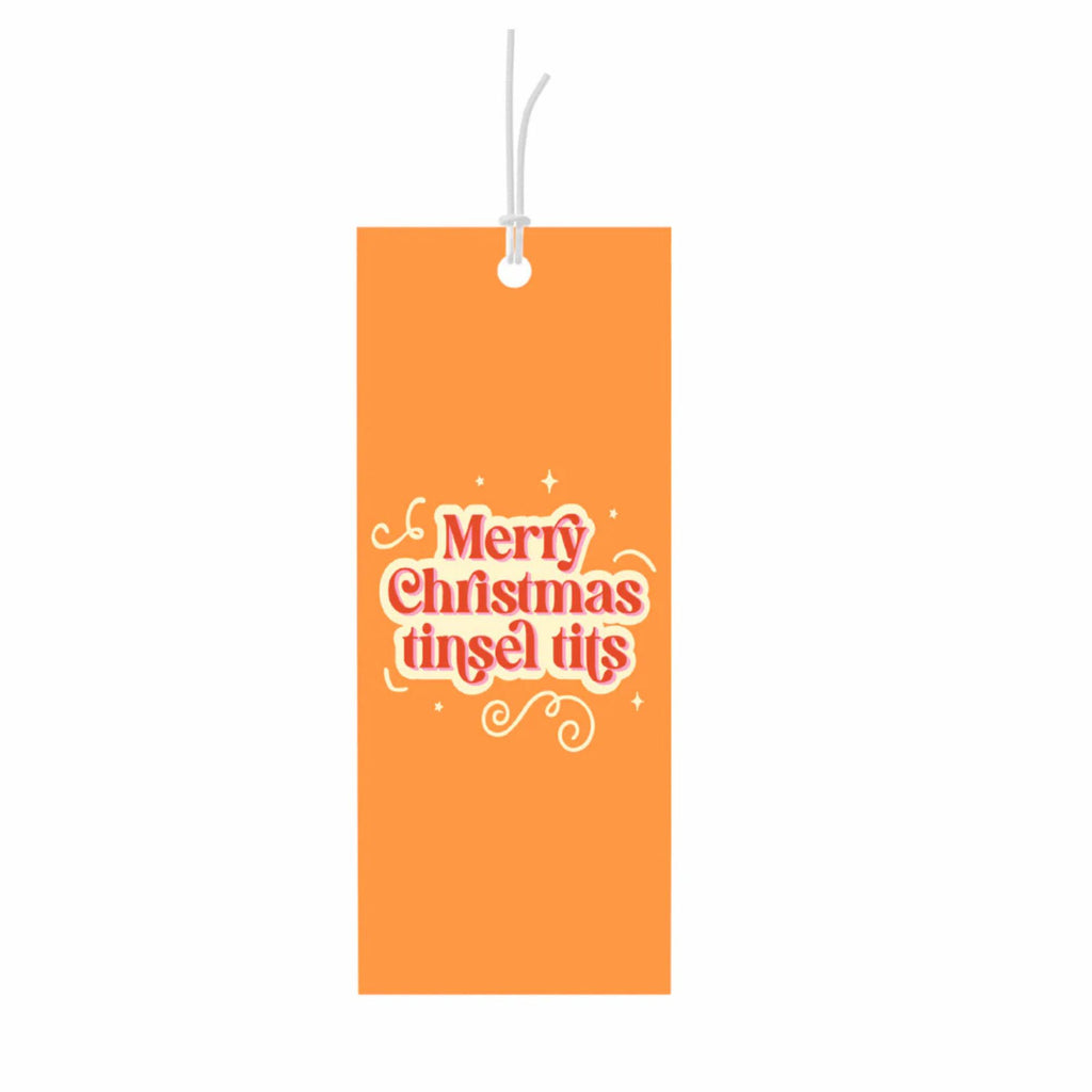 Orange gift tag reading "Merry Christmas tinsel tits" in red and white text"