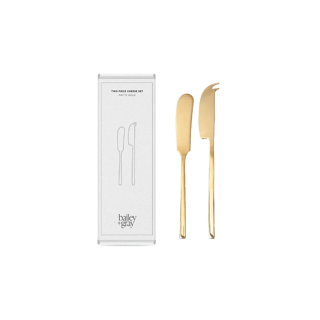 Box and set of two gold cheese knives