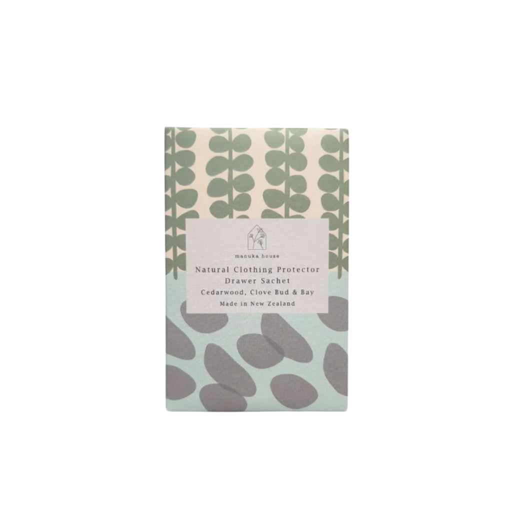 Green, white, blue and grey Patterned package labelled "natural clothing protector drawer sachet