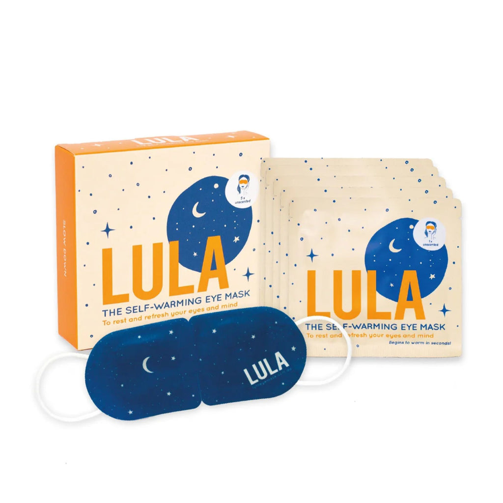 A orange yellow and blue box labelled "lula the self-warming eye mask" with a celestial pattern and moon, with 5 matching packets, and a blue eye mask labelled "luna" with a celestial pattern