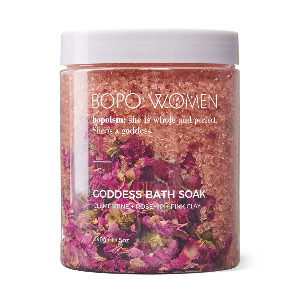 Bopo Women Bath Soak 420g in Goddess.. A clear jar with white lid with pink coloured bath salts sand dried flowers