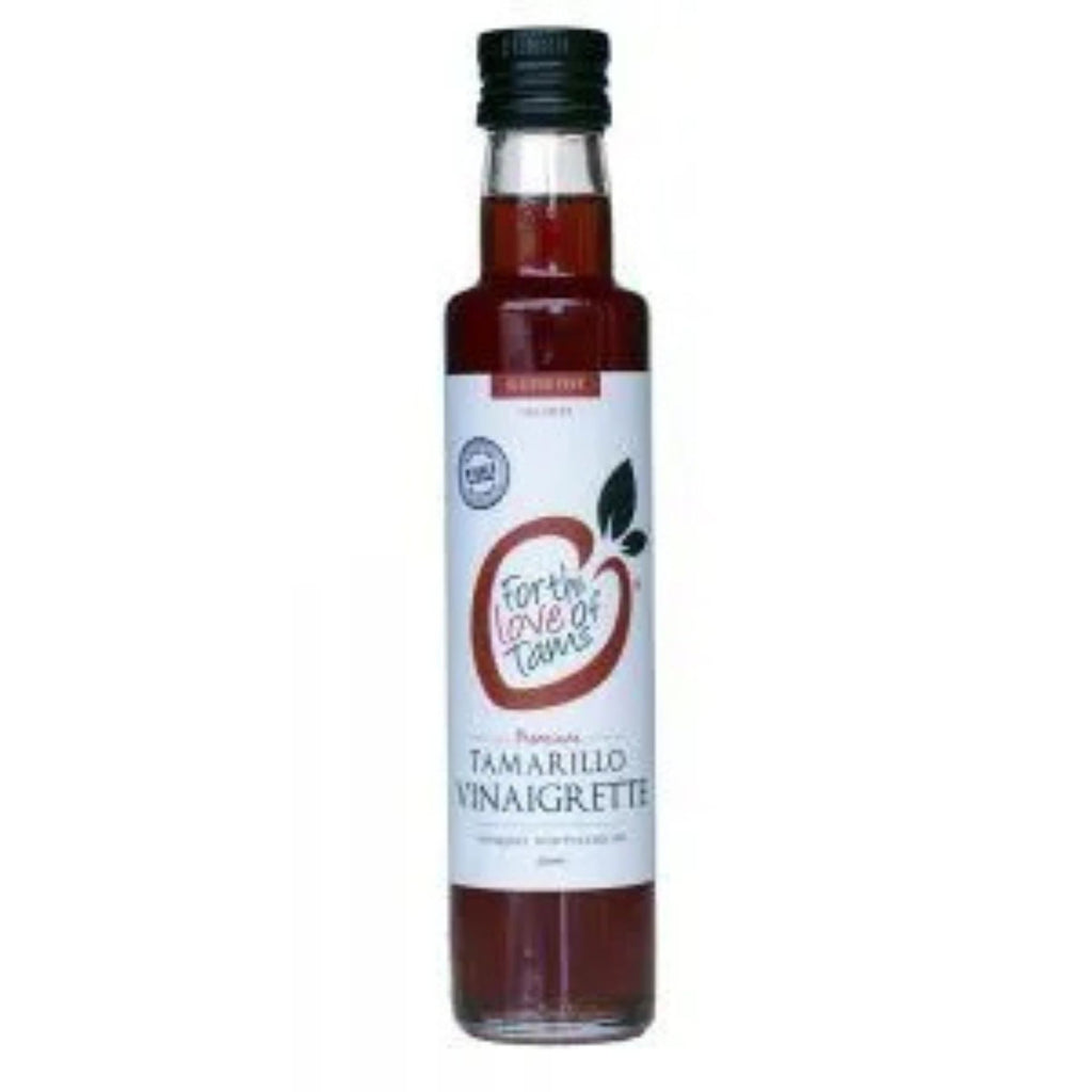 For The Love Of Tams - Tamarillo Vinaigrette. Tall glass bottle with a white label