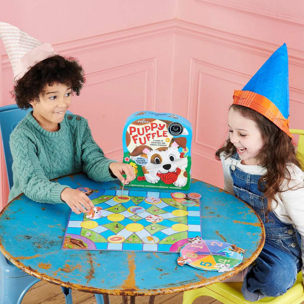 A boy and girl playing a board-game