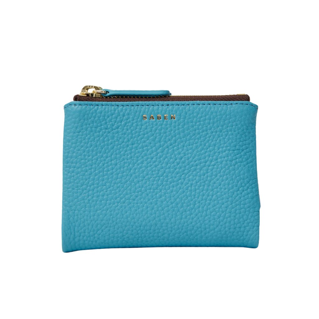 A Blue wallet with Saben written in gold foil across the top, gold zip closure with blue pull tag