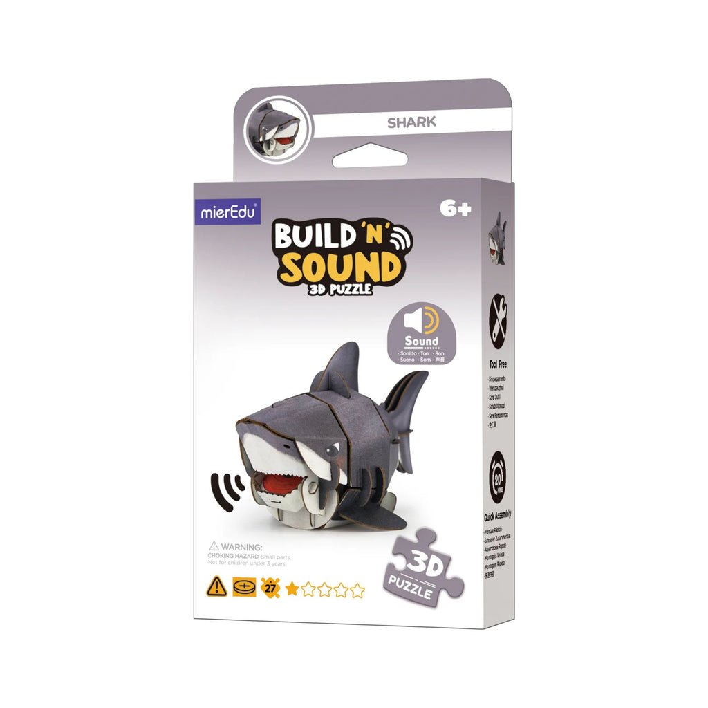 A grey and white box labelled "build 'n' sound 3D puzzle with a cardboard shark puzzle on it