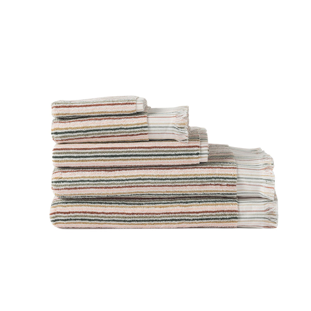 A set of bathroom towels including two towels, a bath matt, hand towel and wash cloth in a folded stack in a multicoloured stripe set