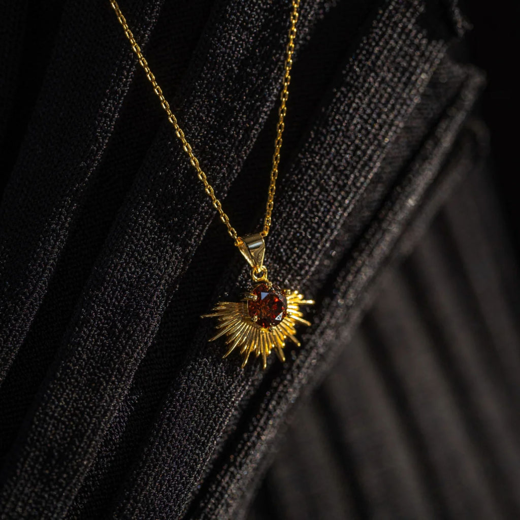 Gold necklace with brown stone