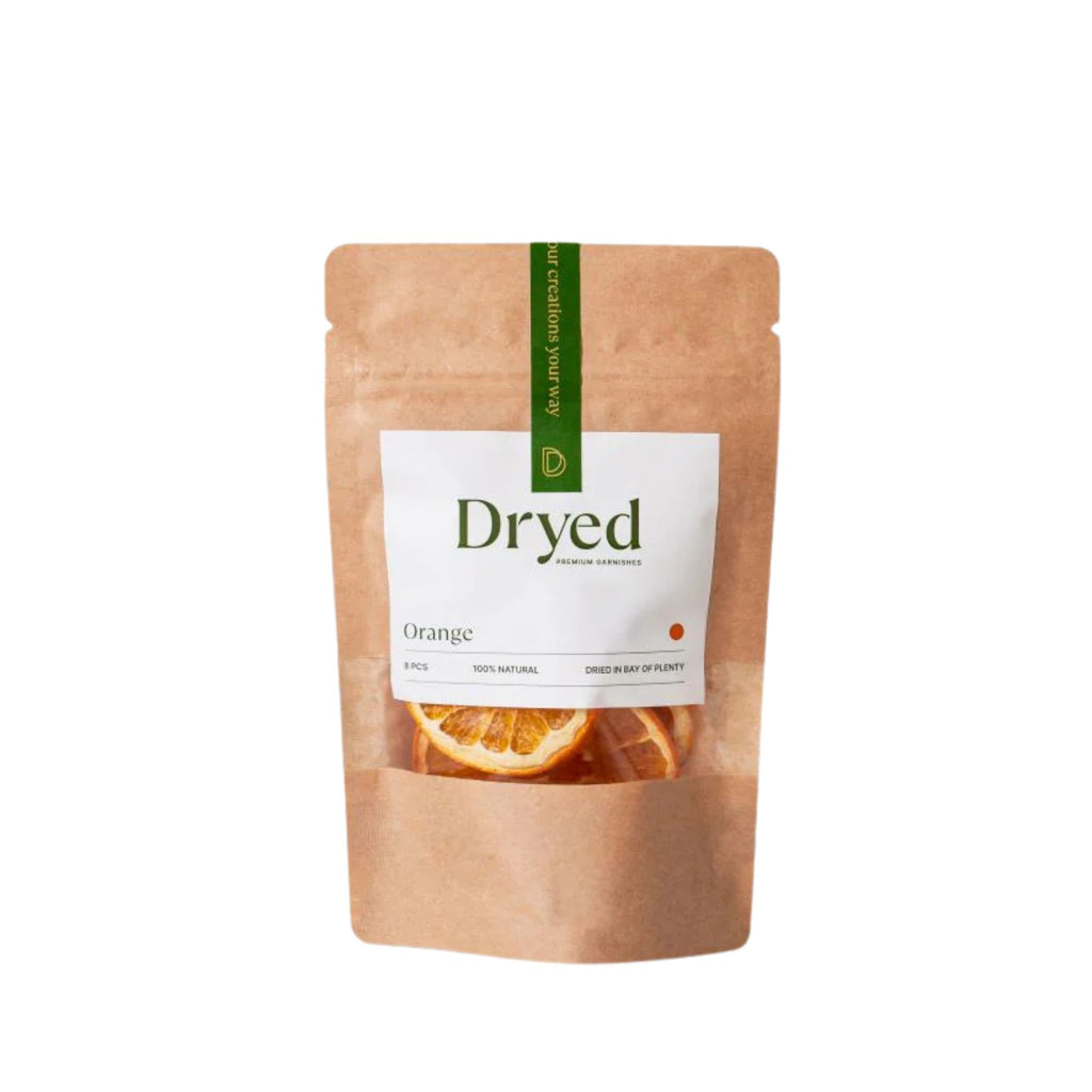 Dryed dehydrated orange slices in a brown kraft pouch with white label