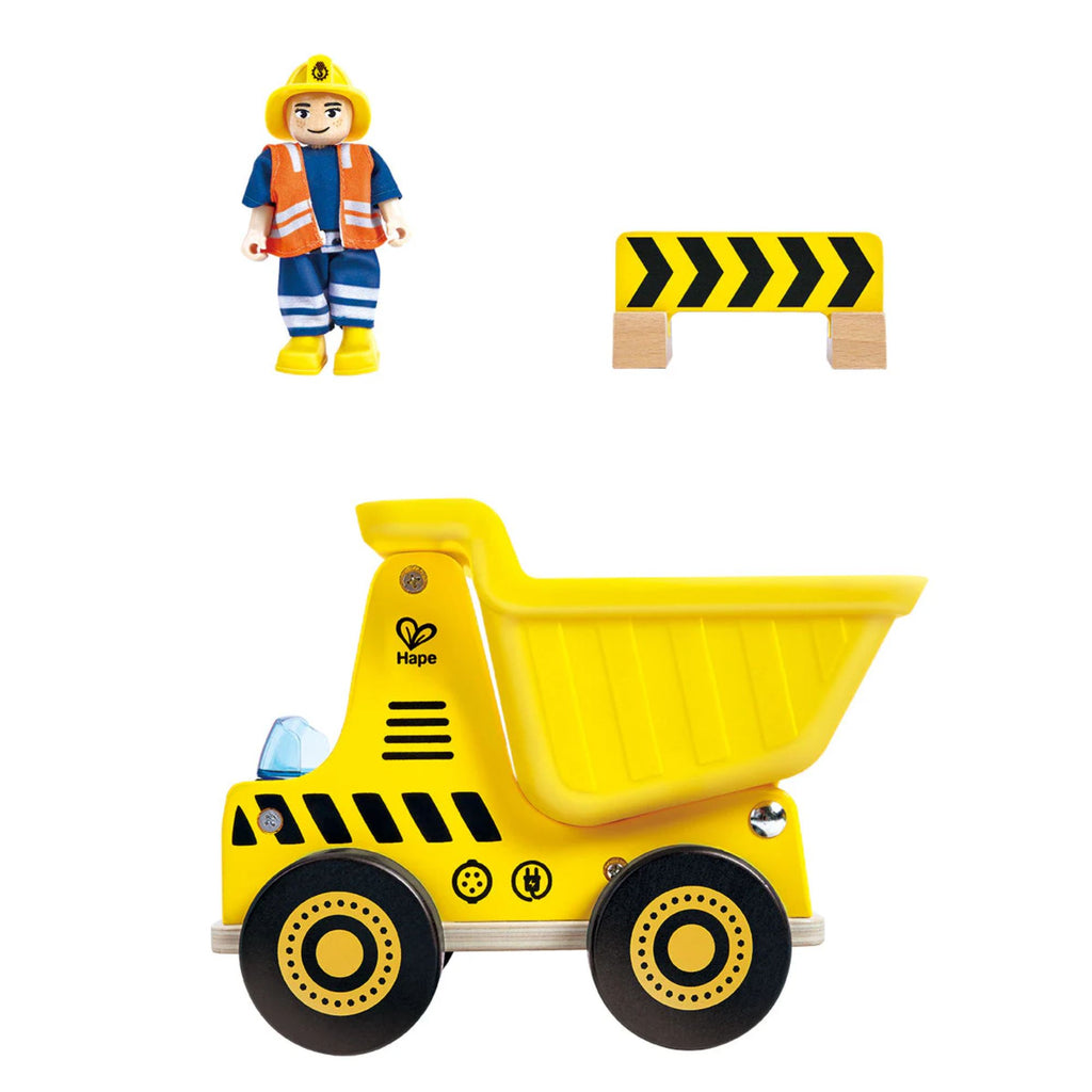 yellow toy dump truck, toy truck driver figure and yellow and black corner sign