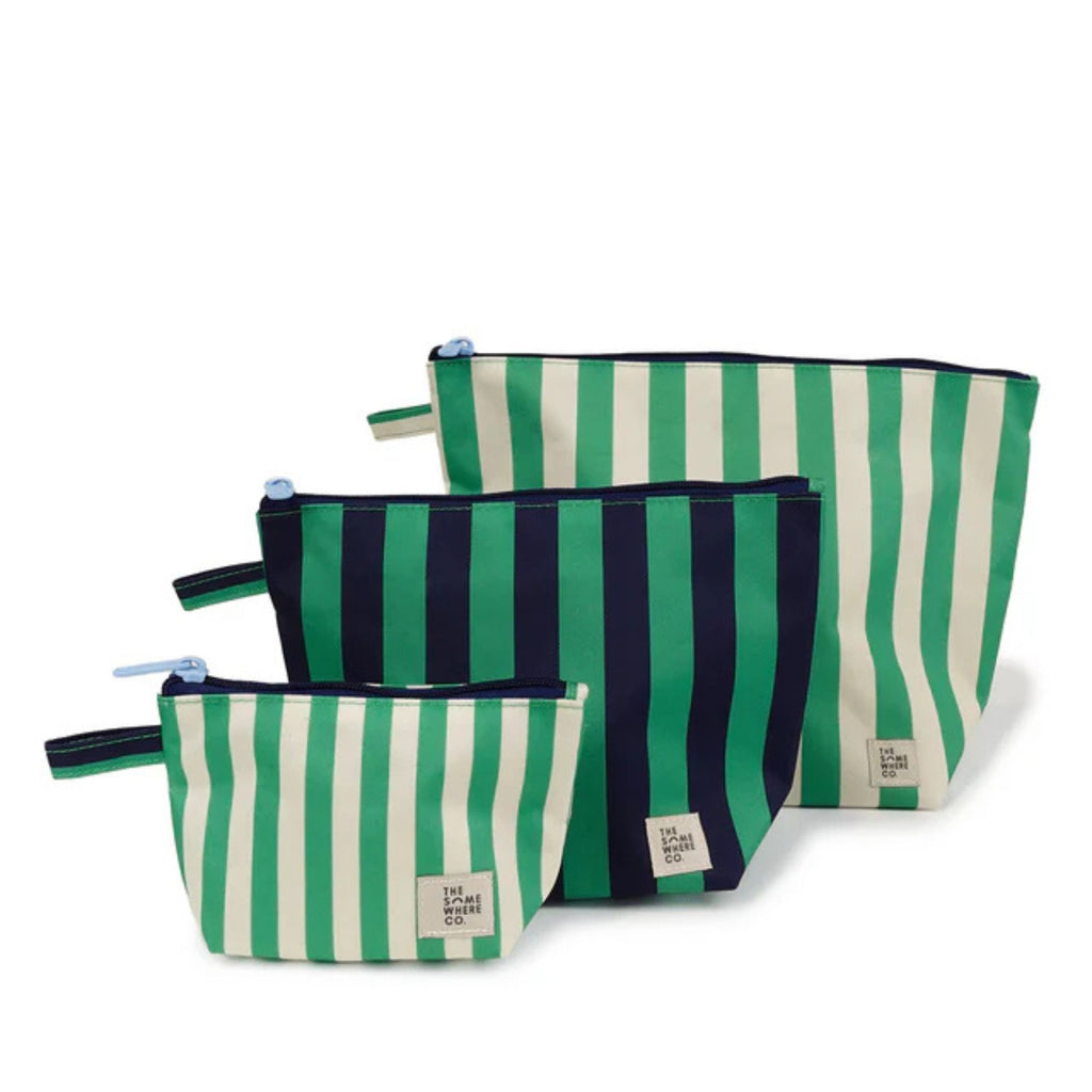 set of three cosmetic pouches against a white background. Features green and white stripe and green and navy stripe zip up bags