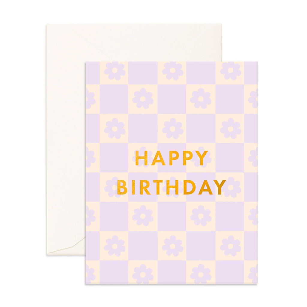 Purple and cream checkered greeting card with daisies reading "happy birthday" in gold font and an envelope