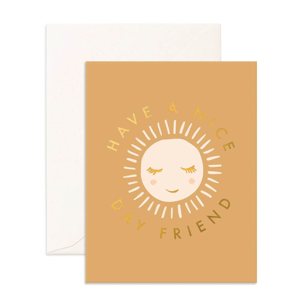 Light orange greeting card with a sun reading "have a nice day friend" in gold text with an evelope