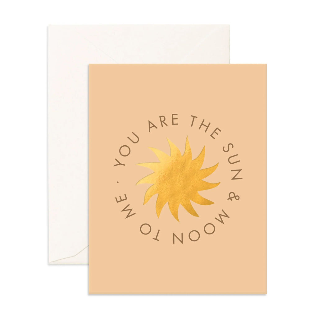 Light orange card with a gold sun reading "you are the sun & moon to me" and a enevelope