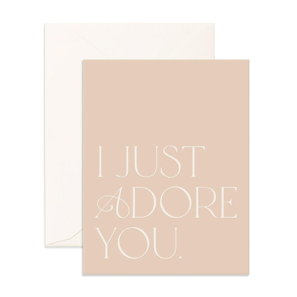 Light pink card reading "I just adore you" in white text with an envelope