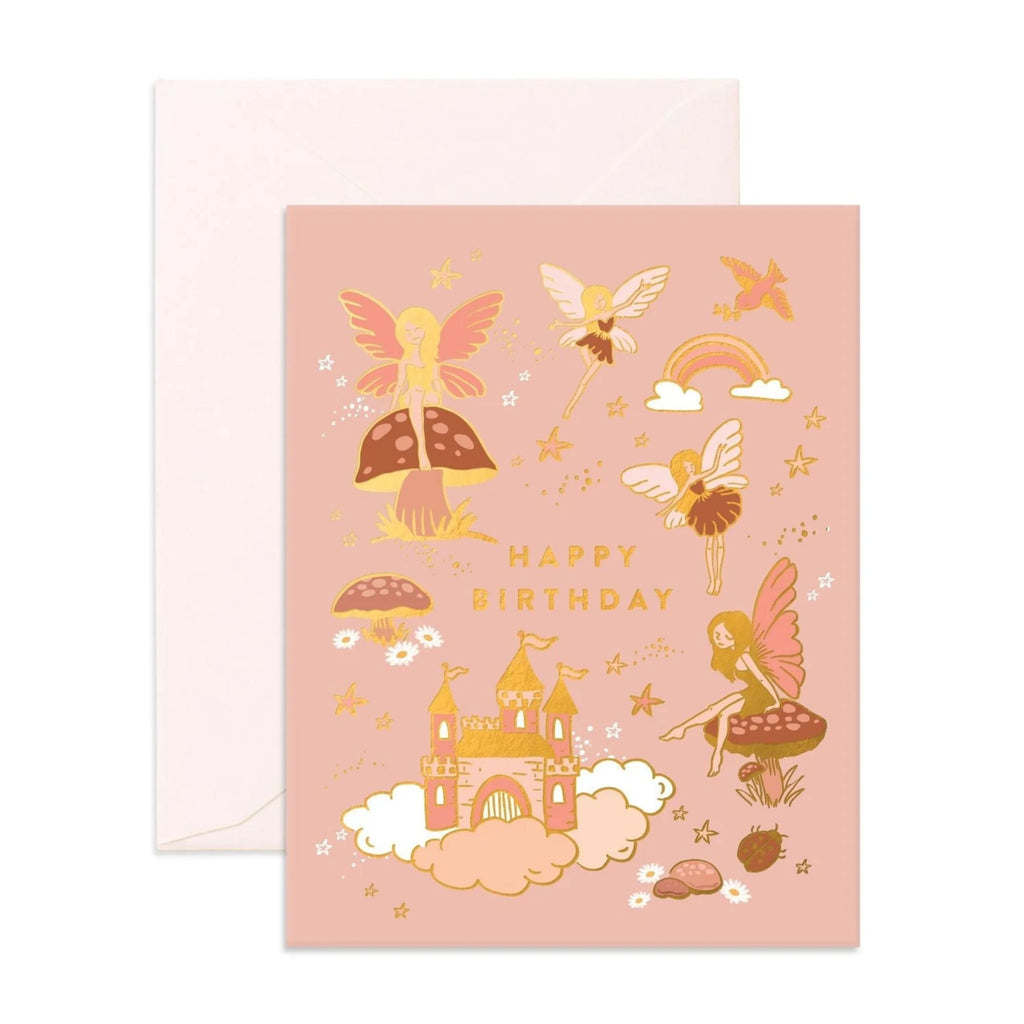 Light pink greeting card with fairies reading "Happy Birthday" in gold text with an envelope