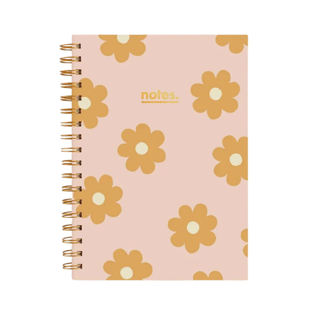 Pink spiral notebook with daisies