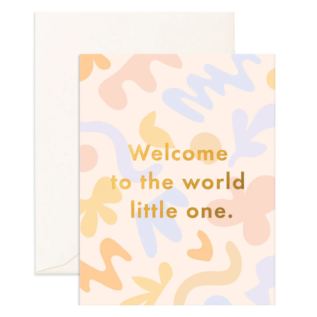 Light pink greeting card with multicoloured shapes and squiggles on it reading "welcome to the world little one." in gold text with an envelope