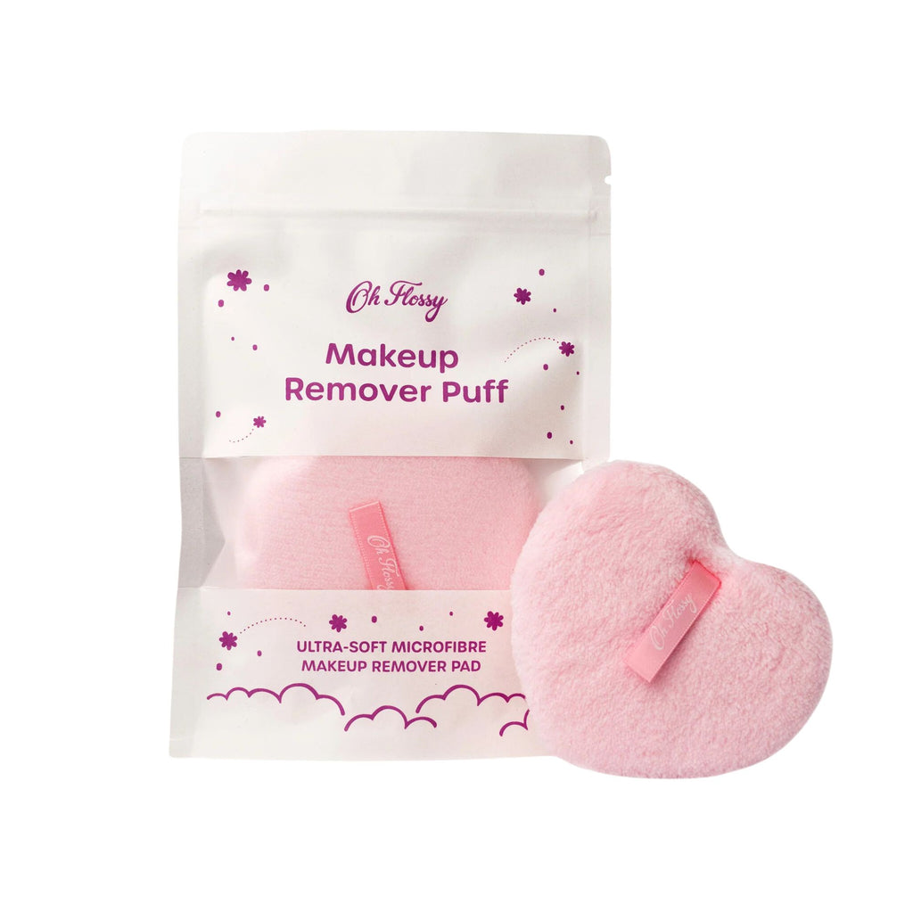 A heart shaped makeup puff application in a white bag labelled "Oh Flossy makeup remover puff"