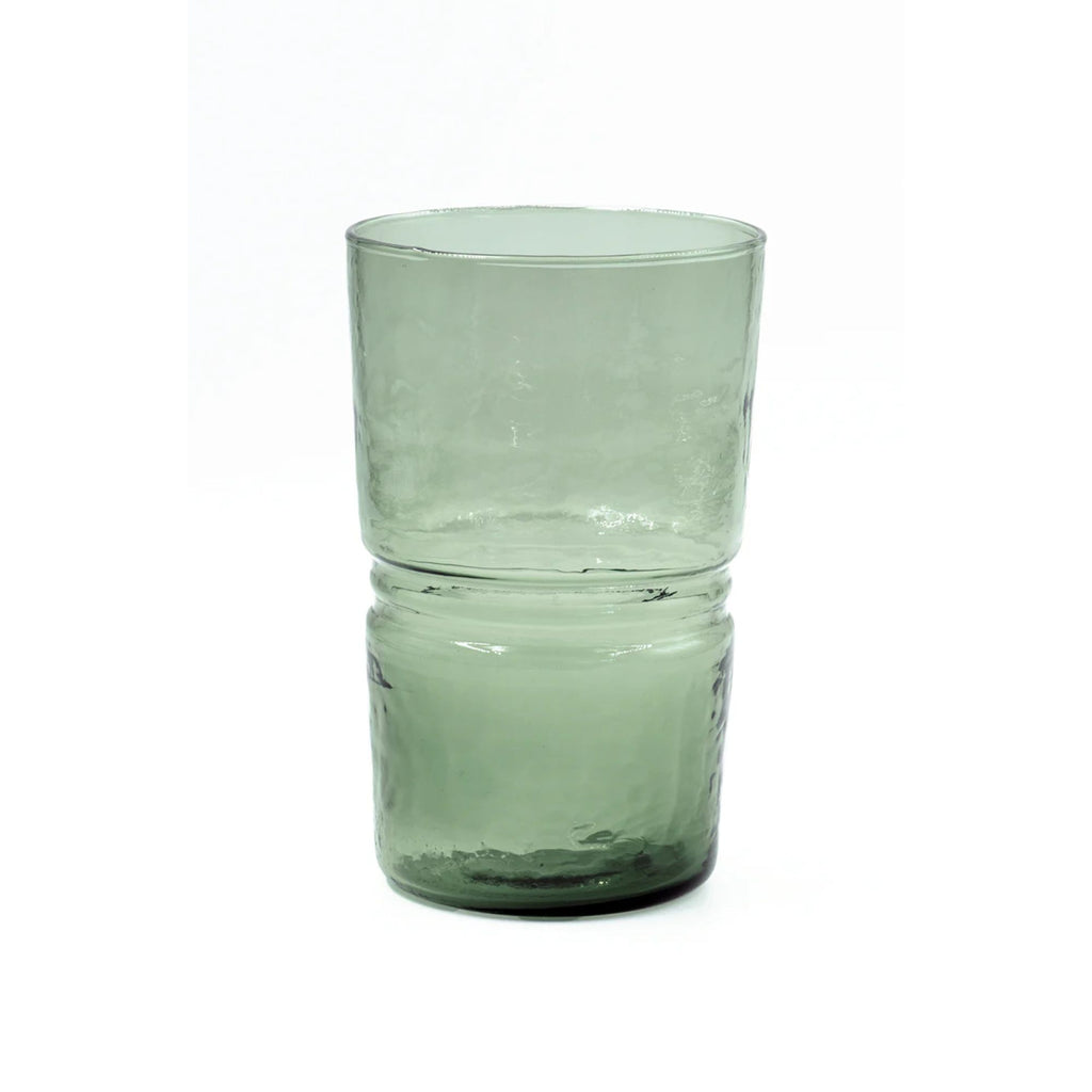 A highball hammered texture green glass on a white background