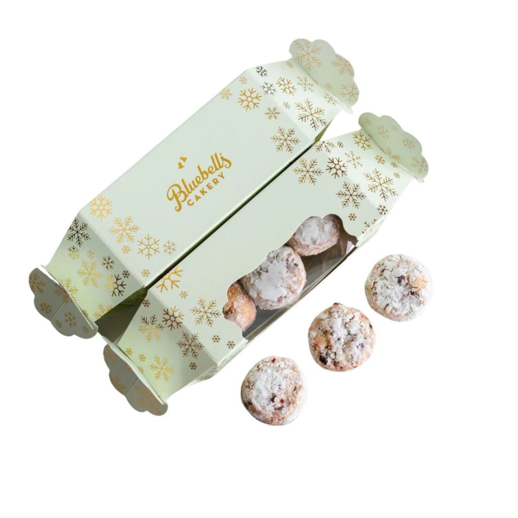 3 Amaretti biscuits with two light blue Christmas cracker shaped boxes