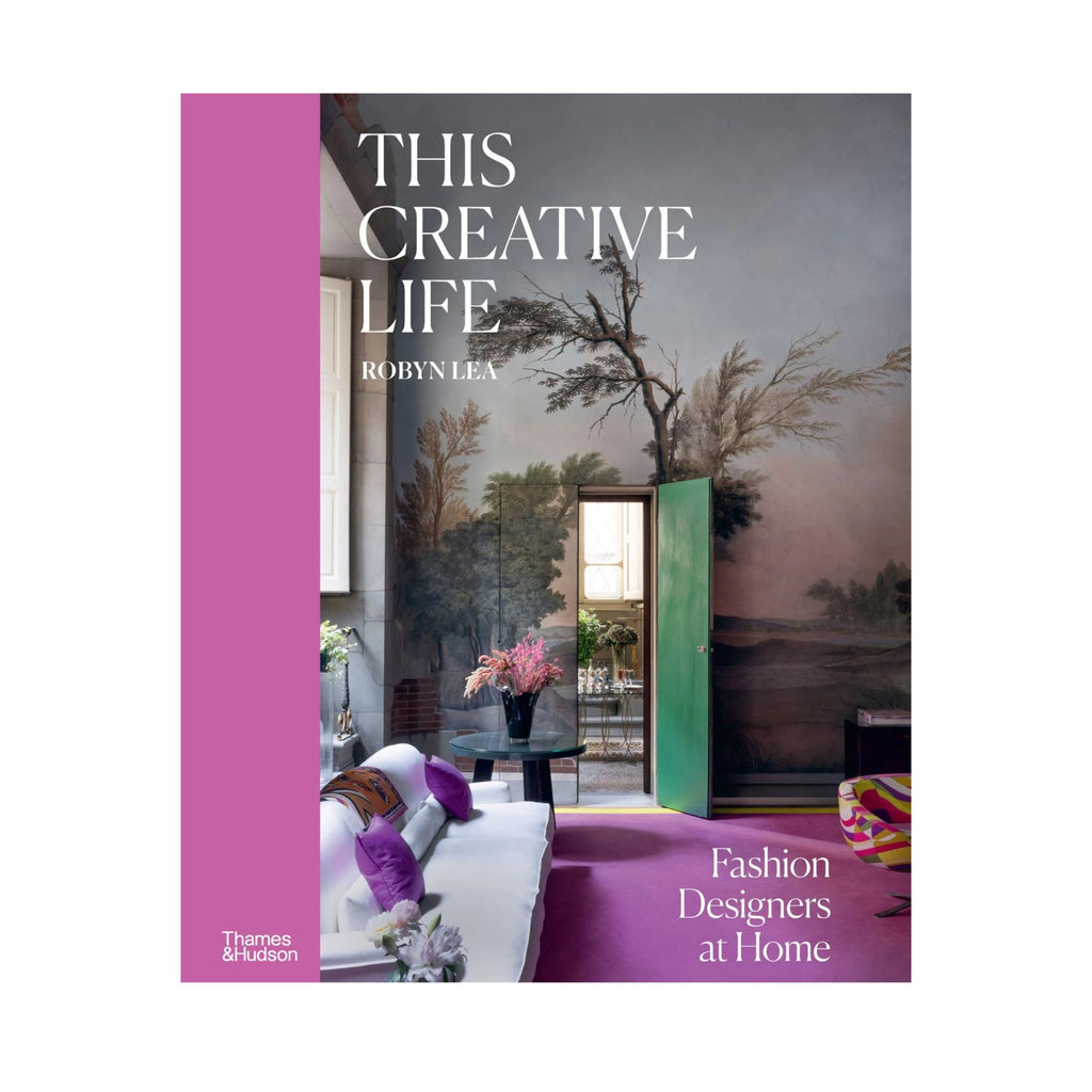 White background with a book cover in the foreground called This Creative Life with an image of an interior and mural wall