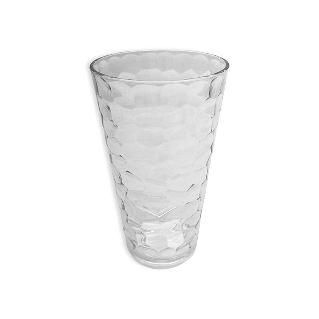 A transparent acrylic highball cup with a hammered finish 