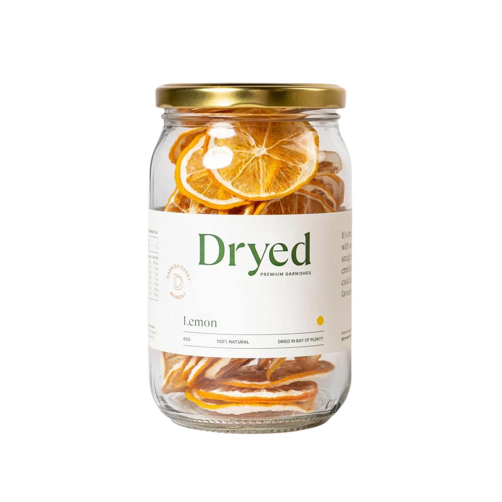 Dryed dehydrated lemon garnish in a clear jar with white label