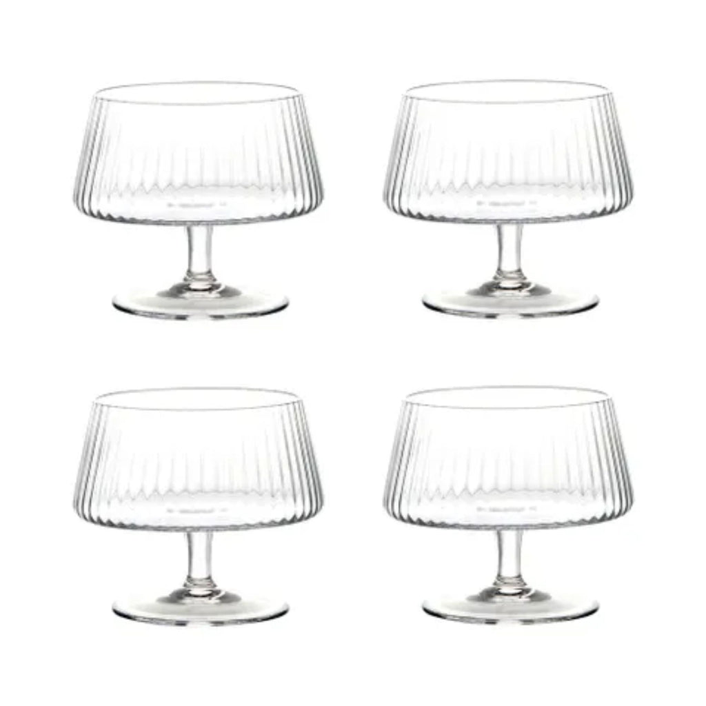 Set of four ribbed glass bowls on stands