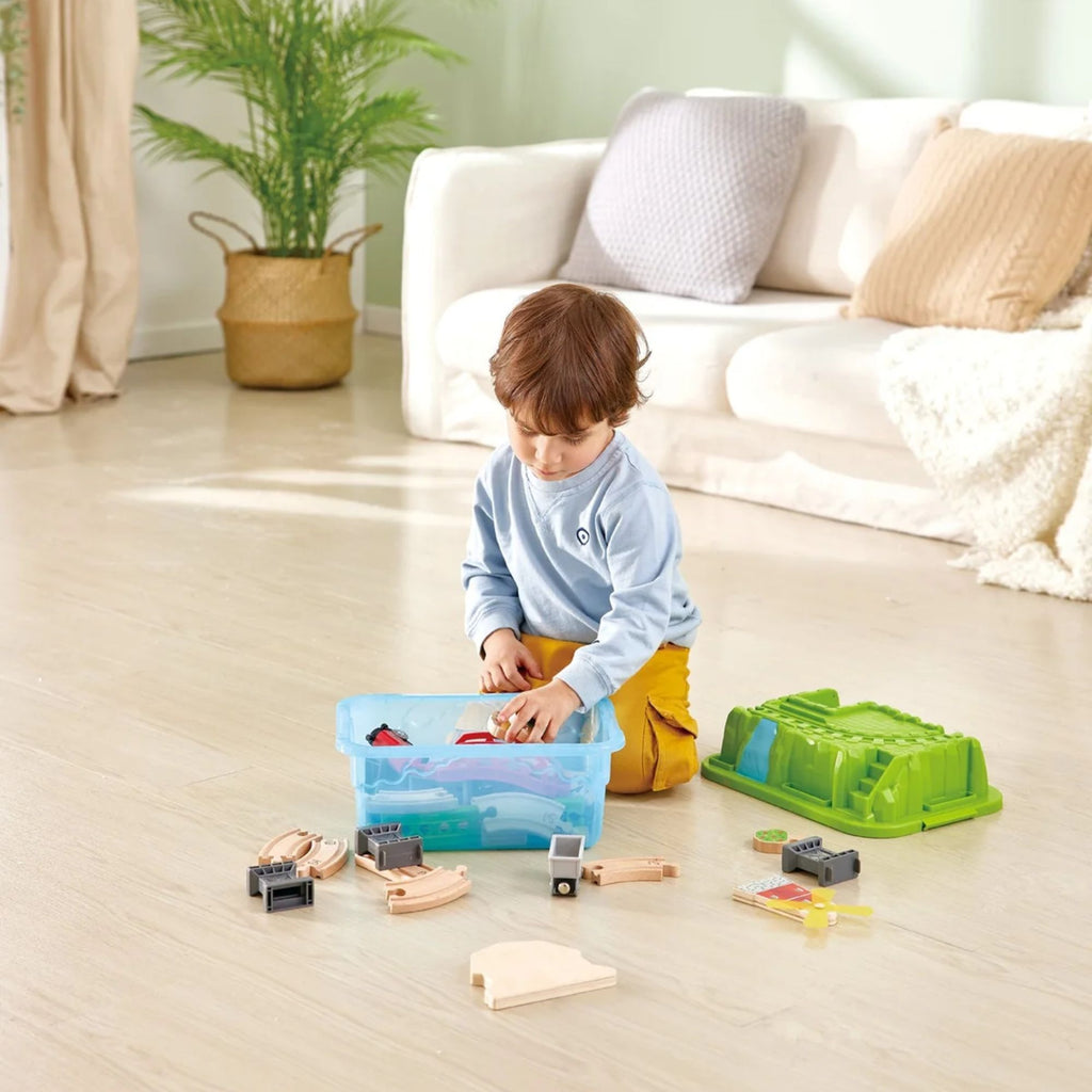 Young boy playing with a train set