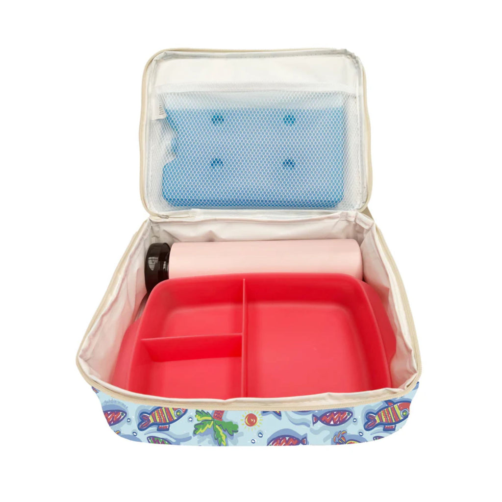 Open blue lunch box with sea creatures pianted on it filled with a red container, white drink bottle and blue ice pak