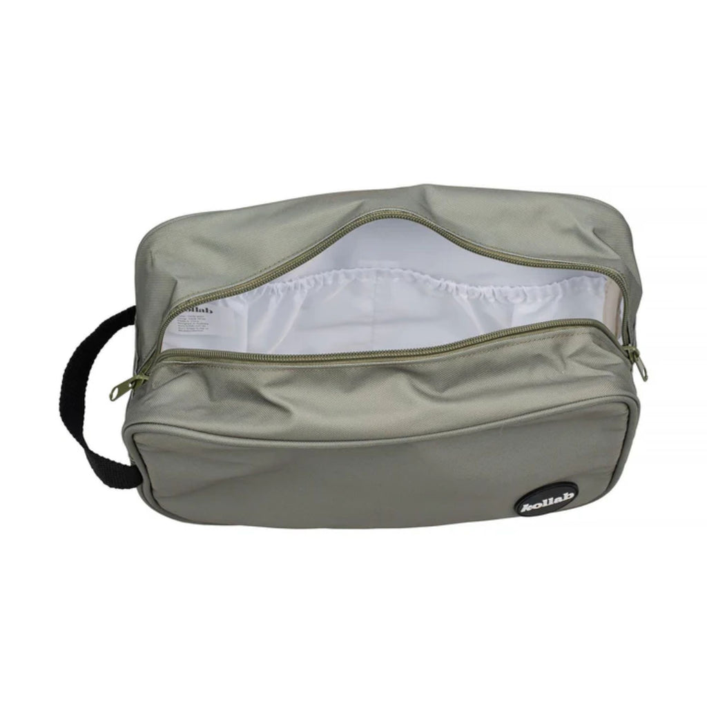 An open khaki travel bag showing a white inner