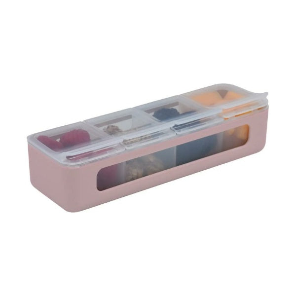 Closed pink and transparent 4 compartment lunch box filled with snacks