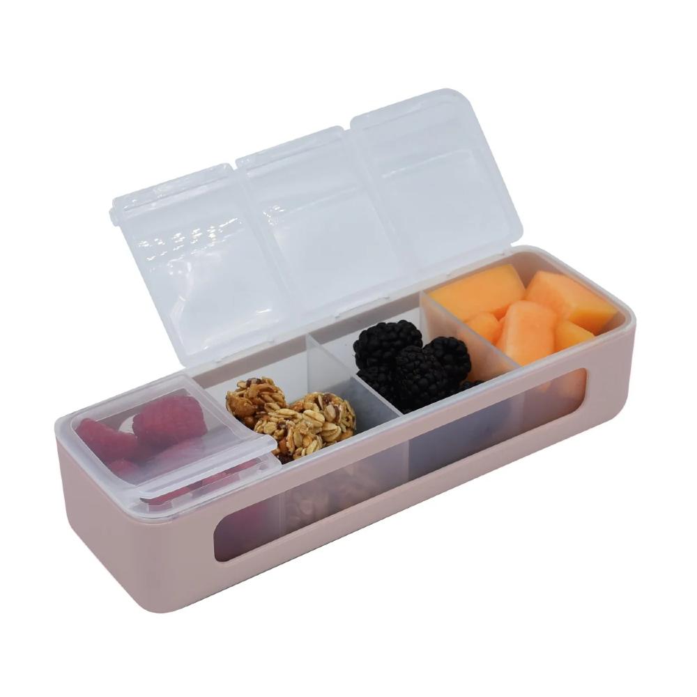 Open pink and transparent 4 compartment lunch box filled with snacks