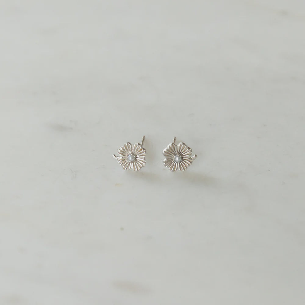 Silver flower studs with a pearl centre