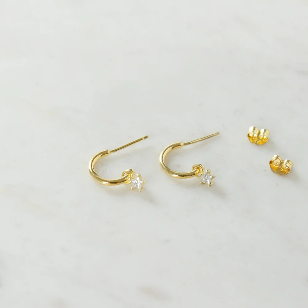 Gold hoop studs with a crystal pendant