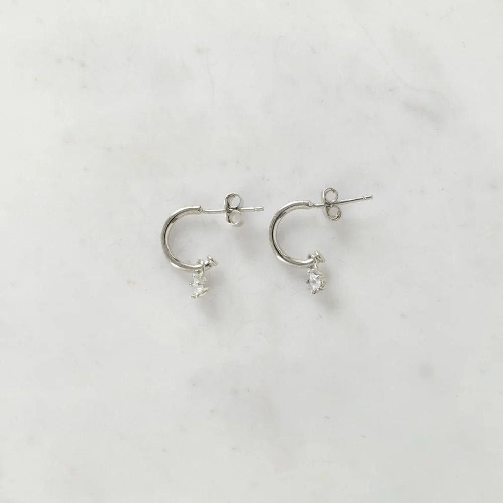 Silver hoop studs with a crystal pendant